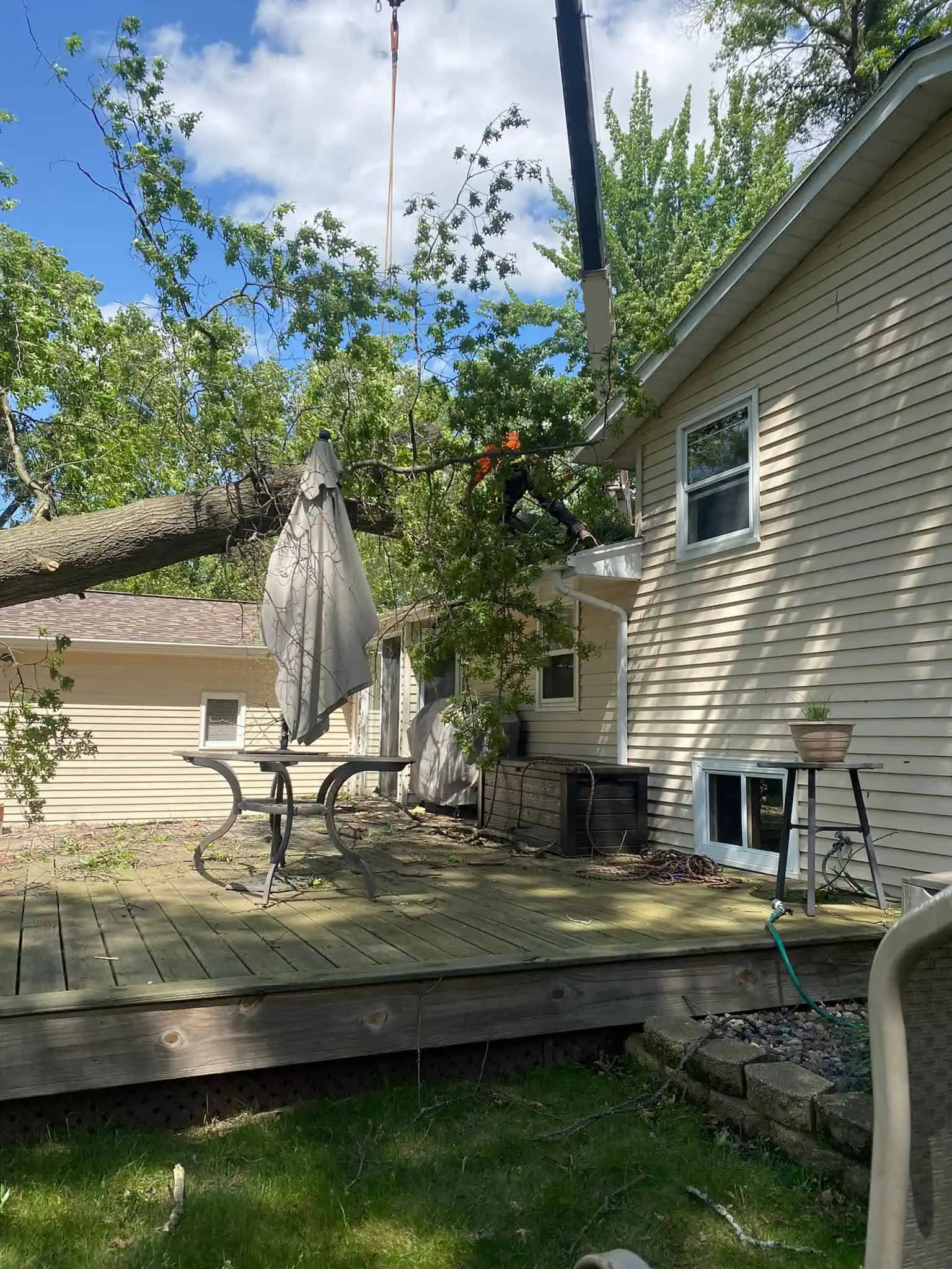 Emergency tree removal from house in Green Bay WI after storm